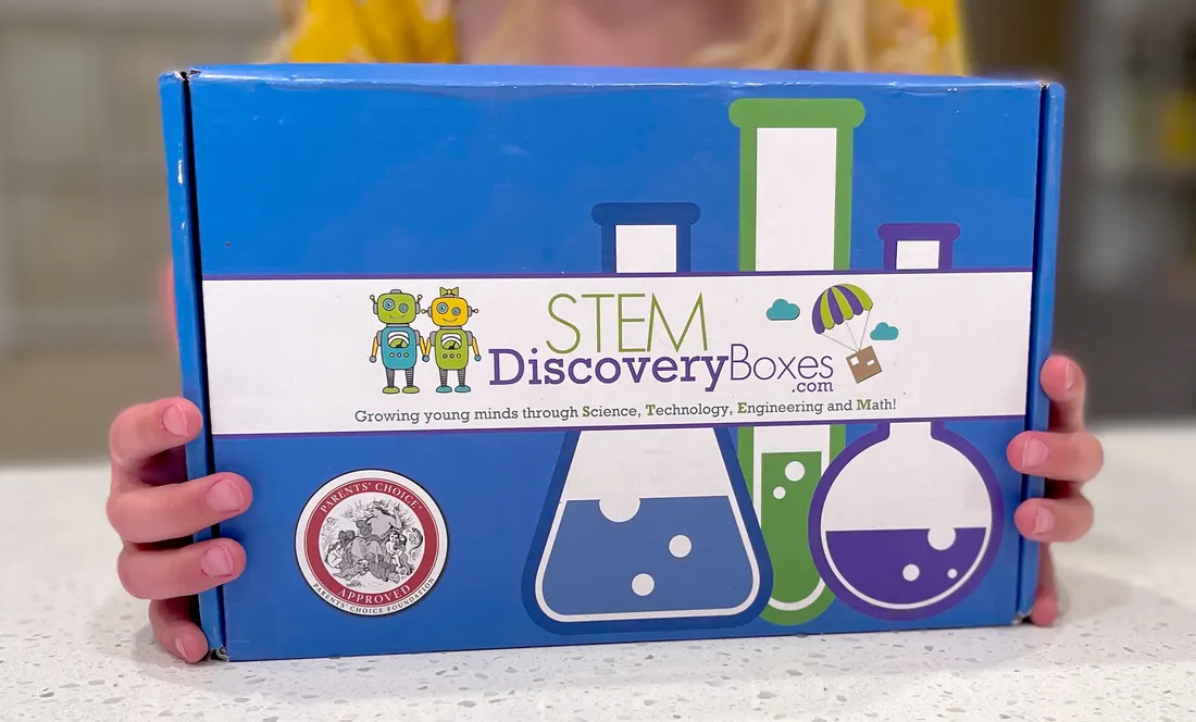 A STEM Discovery Box beside its full set of project supplies
